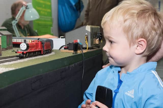 Tristan Davies, four, gets to play with Thomas the Tank engine.
Picture Credit: Keith Woodland