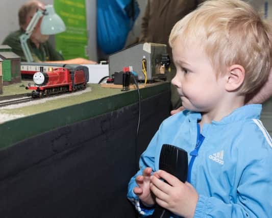 Tristan Davies, four, gets to play with Thomas the Tank engine.

Picture Credit: Keith Woodland