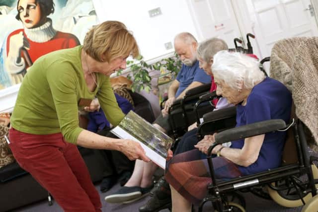 Older persons advocate Jill Phipps (left) helps to lead a dementia-friendly service at a nursing home in Fratton