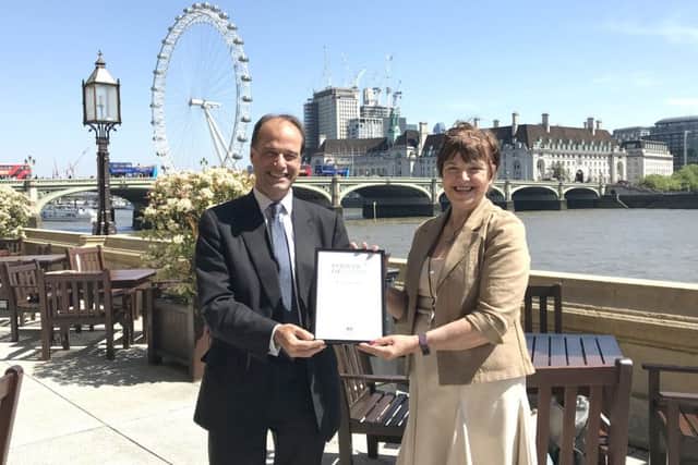 Meon Valley MP George Hollingbery with Dr Wendy Jones who won a Point of Light award from the prime minister