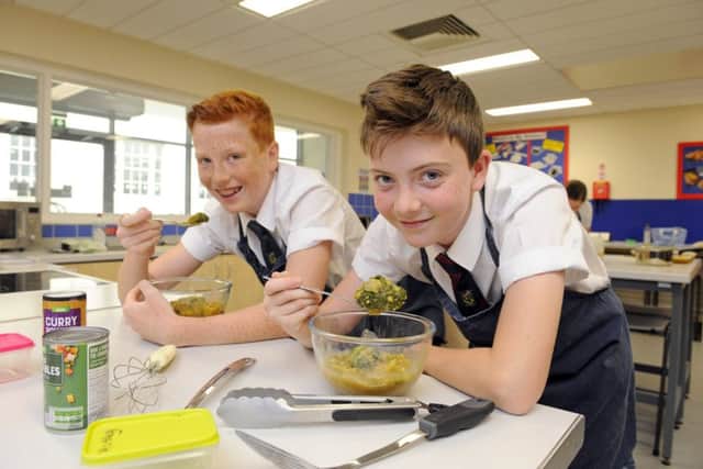 Zach Abraham, left, and Jack Hartley in a cookery class at Purbrook Park School. Picture: Malcolm Wells (180516-8803)
