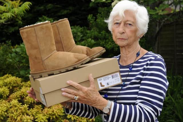 Jean Crabb with her UGG boots which have a water stain after she wore them out in the rain
Picture: Malcolm Wells (180516-8907)