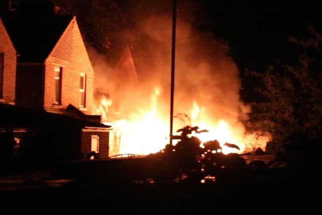 Four sheds were engulfed in flames in Portsmouth