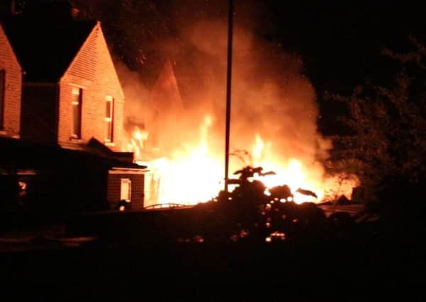 Four sheds were engulfed in flames in Portsmouth