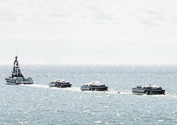 An autonomous minesweeper system that can safely clear sea lanes of mines has been handed over to the Royal Navy