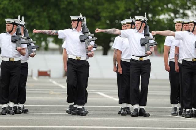 Members of the Royal Navy Small Ships and Diving unit practice on the parade ground at HMS Collingwood in Hampshire, as they prepare for the Royal wedding this weekend where they will provide ceremonial support. Picture: Andrew Matthews/PA Wire