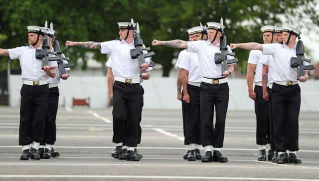 Members of the Royal Navy Small Ships and Diving unit practice on the parade ground at HMS Collingwood in Hampshire, as they prepare for the Royal wedding this weekend where they will provide ceremonial support. Picture: Andrew Matthews/PA Wire