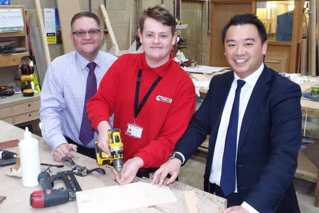 Alan Mak MP and apprentice Tom Curley at Comserv in Havant. Picture: Alex Rennie