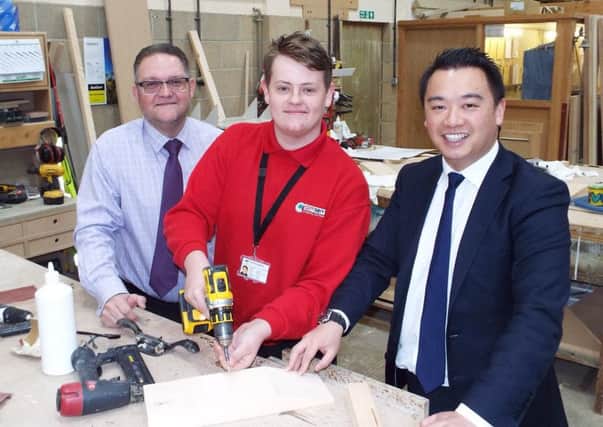 Alan Mak MP and apprentice Tom Curley at Comserv in Havant. Picture: Alex Rennie