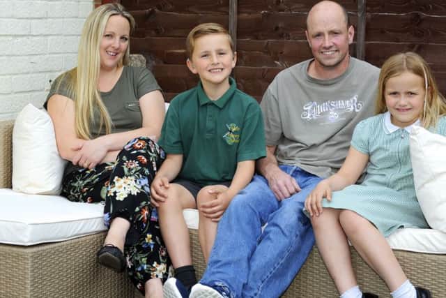 Pianist Lewis Heaysman (9) at his Portchester home with his family, from left, mum Emma, dad Paul Heaysman and little sister Charlotte     Picture by Malcolm Wells (180516-4888)