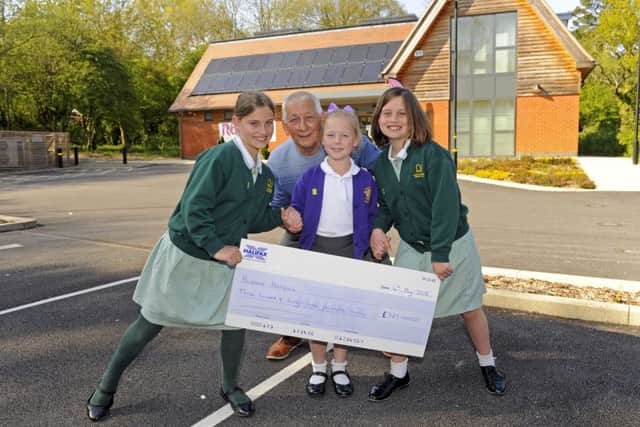 Philip Poat with, from left Talia Rutter. Millie Booth and Anya Rutter (9) at The Rowans Living Well Centre Picture: Malcolm Wells (180504-7104)