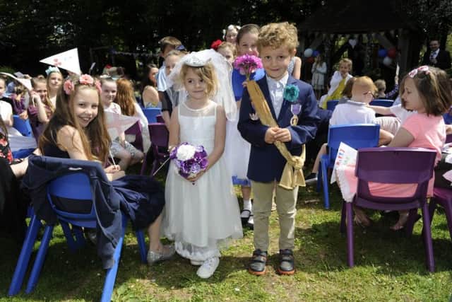 Reuben Kefford and Ava Connor, both six, play the bride and groom in  Tichfield Primary School's mock-up royal wedding. Picture: Ian Hargreaves (180470-1)