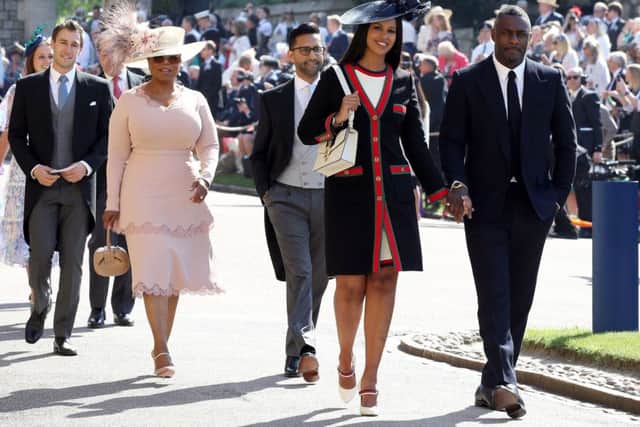 Idris Elba and Sabrina Dhowre followed by Oprah Winfrey (fourth right) arrive at St George's Chapel at Windsor Castle for the wedding of Meghan Markle and Prince Harry. Picture: Chris Radburn/PA Wire