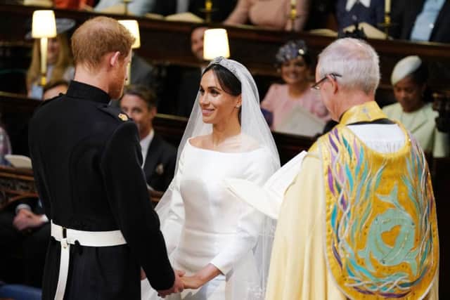 Prince Harry and Meghan Markle in St George's Chapel at Windsor Castle during their wedding service, conducted by the Archbishop of Canterbury Justin Welby. Picture: Dominic Lipinski/PA Wire