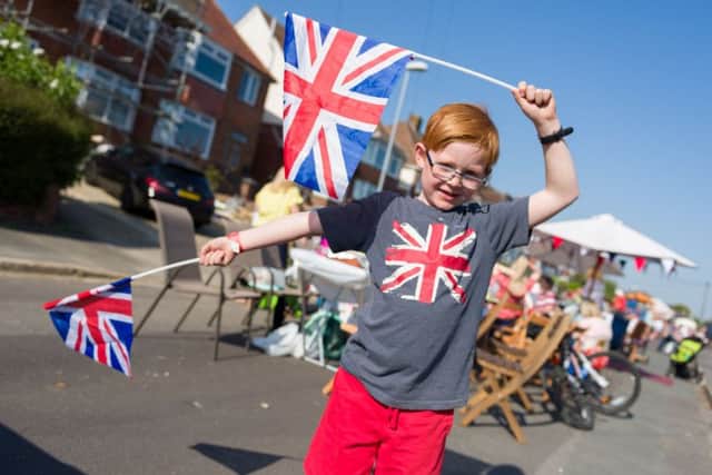 Charlie Alderton, seven, celebrating the royal wedding in Woodfield Avenue.
Picture: Duncan Shepherd