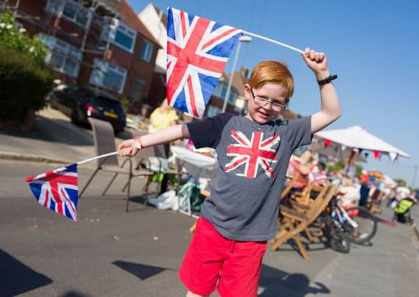Charlie Alderton, seven, celebrating the royal wedding in Woodfield Avenue. 
Picture: Duncan Shepherd