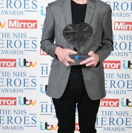 Lewis Hine, 17, from Havant wins the Special Recognition Award at the NHS Heroes Awards at the Hilton Hotel in London. Picture: Ian West/PA Wire