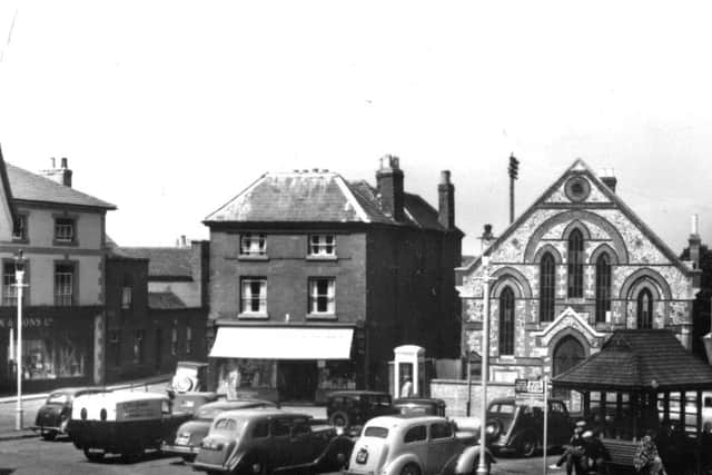 Vintage cars in Emsworth  Vintage cars on view in Emsworth Square. Is the telephone box painted red? Picture: Barry Cox collection