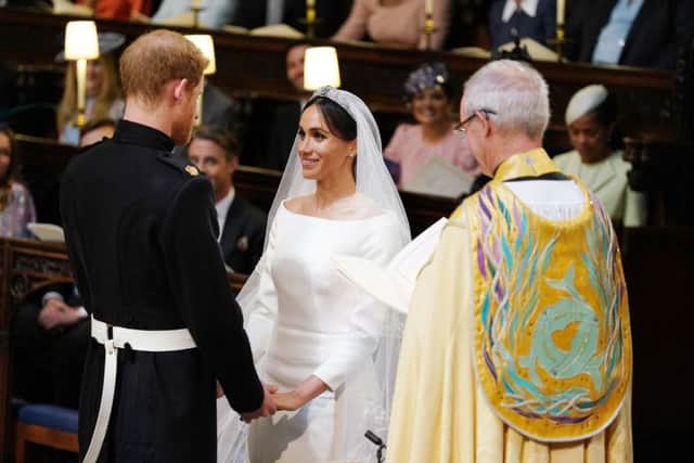 Prince Harry and Meghan Markle in St George's Chapel at Windsor Castle during their wedding service, conducted by the Archbishop of Canterbury Justin Welby. Picture: Dominic Lipinski/PA Wire