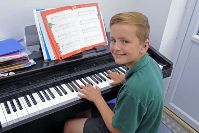 Lewis Heaysman, who is deaf, won a place at a prestigious arts festival due to his fantastic piano skills Picture by:  Malcolm Wells (180516-9017)