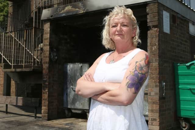 Kim Price standing outside one of the areas set on fire in Buckland.  Picture: Habibur Rahman