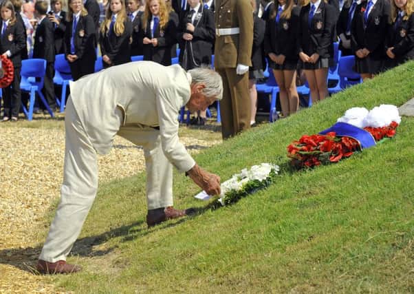 COPP survivor Jim Booth lays a wreath on The COPP Memorial 
on Hayling Island in 2015. Picture: Malcolm Wells