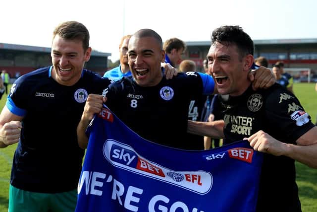 Gary Roberts, right, celebrates Wigan's League One title success with his Latics team-mates