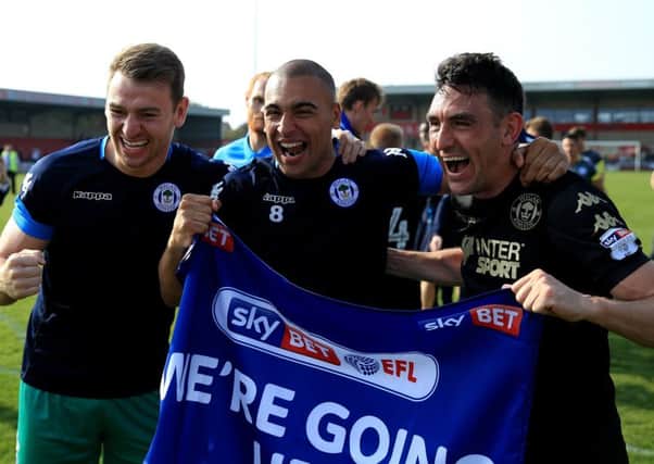 Gary Roberts, right, celebrates Wigan's League One title success with his Latics team-mates