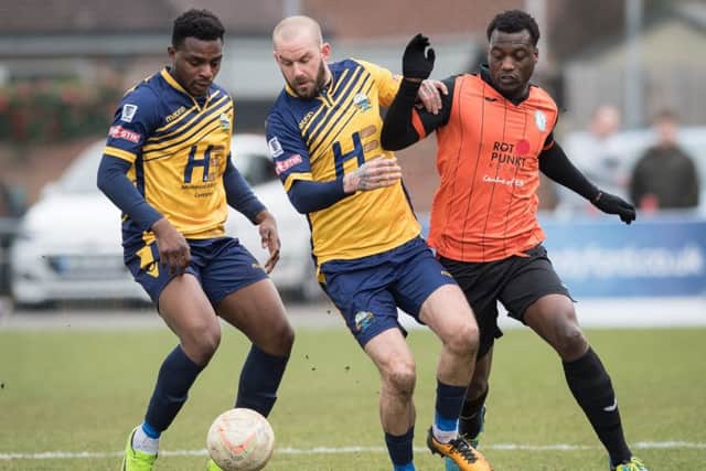 Toyosi Olusanya, left, with Rowan Vine in action for Gosport. Picture Credit: Keith Woodland