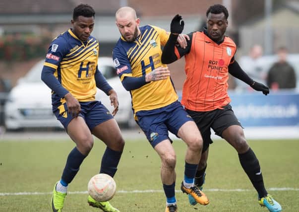 Toyosi Olusanya, left, with Rowan Vine in action for Gosport.  Picture Credit: Keith Woodland