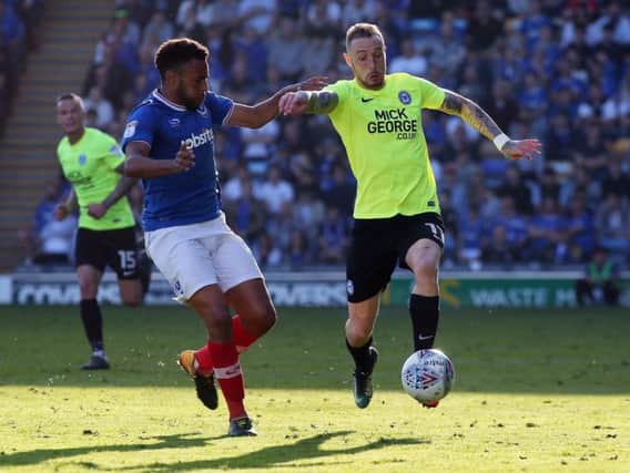 Marcus Maddison in action for Peterborough against Pompey on the final day of the season