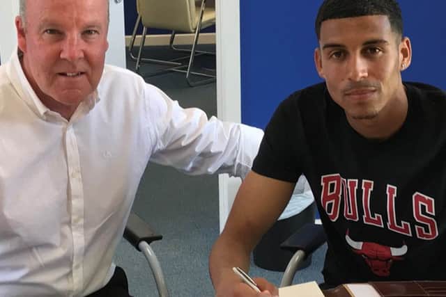 Louis Dennis with Pompey boss Kenny Jackett. Picture: Neil Weld/Portsmouth FC
