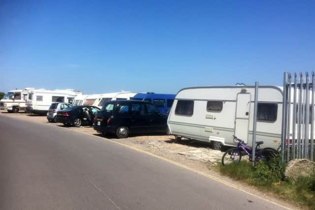Travellers camp caravans off road at Ferry Road site