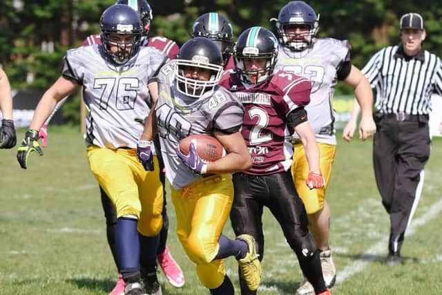 Running back Jethin George bursts through the Hastings defence Picture: Neil Marshall