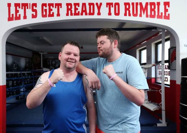 Brothers Jamie (left) and Darryn McClelland will have a fundraising boxing match in a month's time, on behalf of the Amelia-Mae Foundation. They are pictured at Bessey's Gym, Leigh Park Community Centre, Havant                                     Picture: Chris Moorhouse