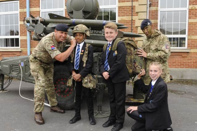 Captain Danny Wright with Year 8 pupils (left to right) Isaac Bello (12), Zak Sargant (12) and kneeling Olivia East (13) with Lbdr. Andy Bowman Picture by Malcolm Wells (180524-0054)