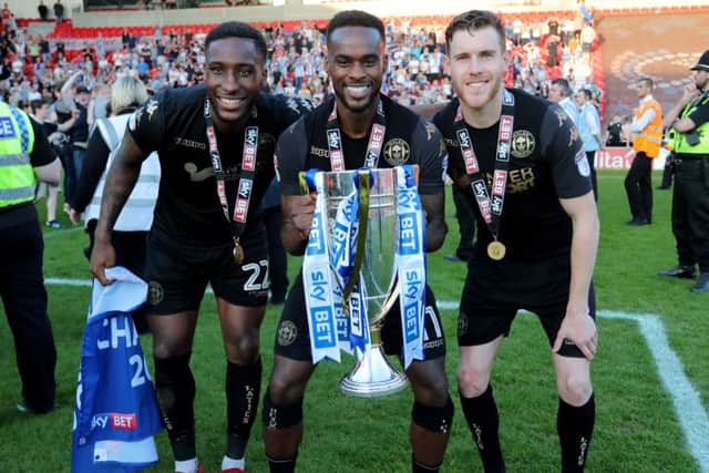 Gavin Massey, centre, celebrated the League One title with Wigan this season
