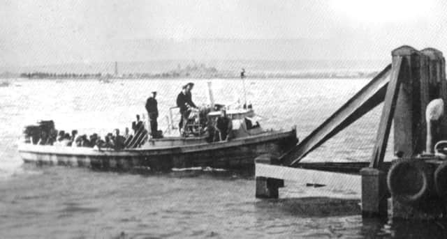 The Portsmouth to Hayling ferry arrives at Hayling  No date for this photograph  but it is an unchanging scene across Langstone Harbour.