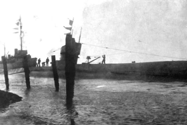 Oops! In the mud at Point, Old PortsmouthI am sure someone was in the mud for allowing this to happen. It is Submarine H23 stranded in the mud at Point, Old Portsmouth.