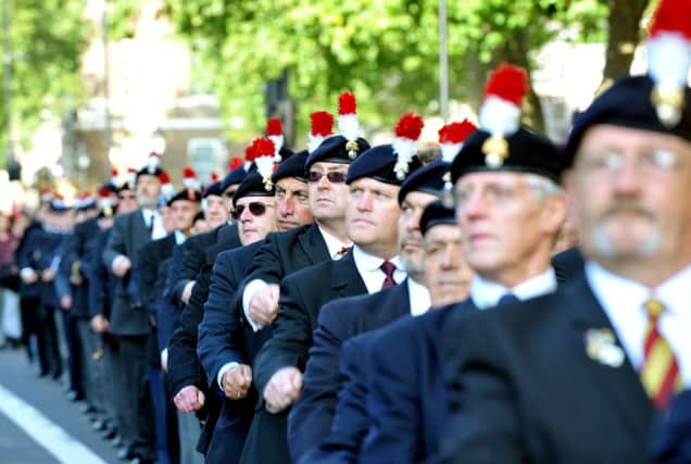 Former Fusiliers, marching along Whitehall in Westminster. Nick Ansell/PA Wire
