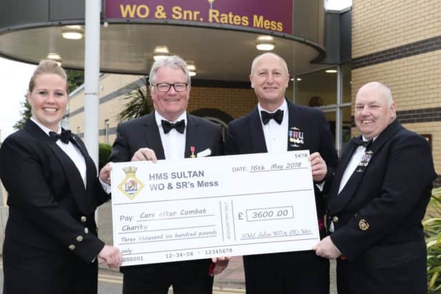 Jim Davidson OBE is presented with a cheque for Care After Combat by HMS Sultan. Picture: PO Phot Nicola Harper