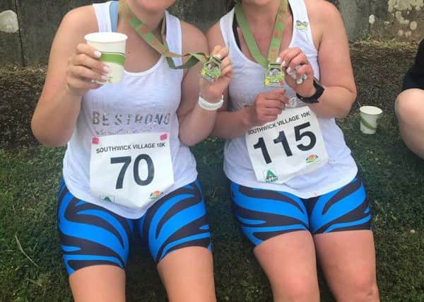 A hot and tired Verity, left, with running pal Anneke