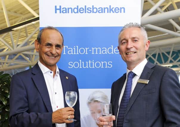 Handelsbanken's 

Nick Lacobucci with manager Phil Redman 
Picture by: Malcolm Wells