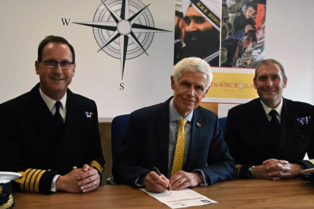 Sir Alan Massey chief executive of the MCA, centre, with Royal Navy Captain Matt Bolton, assistant chief of staff (Engineering Support), left, and Commander Adam Northover, right