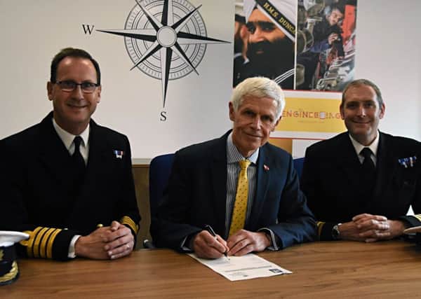 Sir Alan Massey chief executive of the MCA, centre, with Royal Navy Captain Matt Bolton, assistant chief of staff (Engineering Support), left, and Commander Adam Northover, right