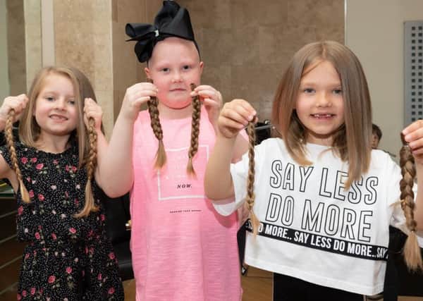Isla, Trixe and India with the braids that will go to make wigs at the Little Princess Trust.

Picture Credit: Keith Woodland