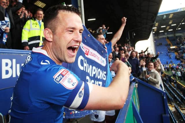 Michael Doyle celebrates Pompey's League Two title success Picture: Joe Pepler