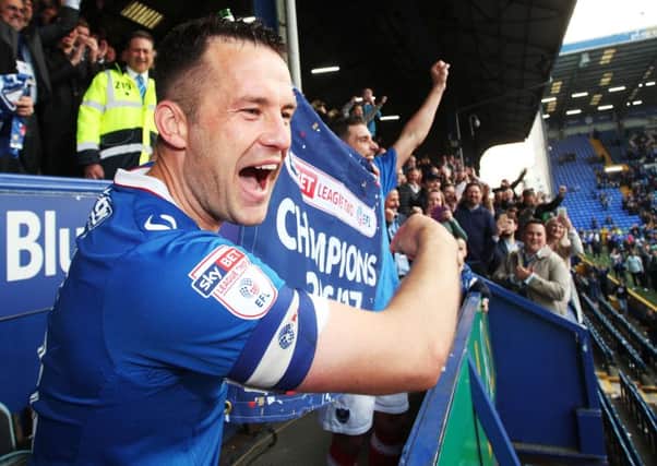 Michael Doyle celebrates Pompey's League Two title success Picture: Joe Pepler