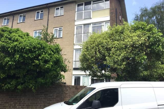 The scene in Highams Hill, Gossops Green, Crawley, West Sussex on Saturday after a woman in her 20s was found dead in a bed in a flat. Picture: Flora Thompson/PA Wire