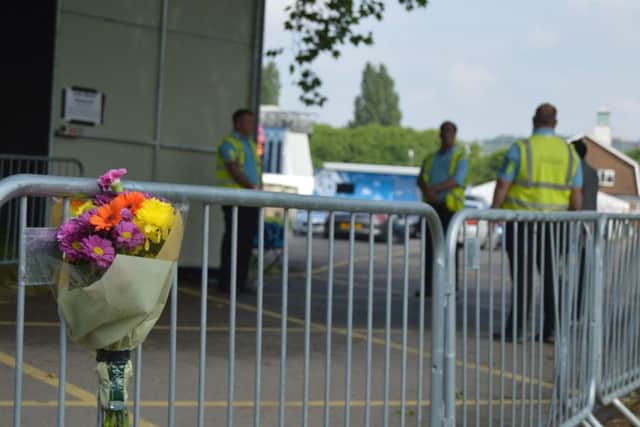 Flowers have been left at the entrance to Mutiny Festival. Picture: David George